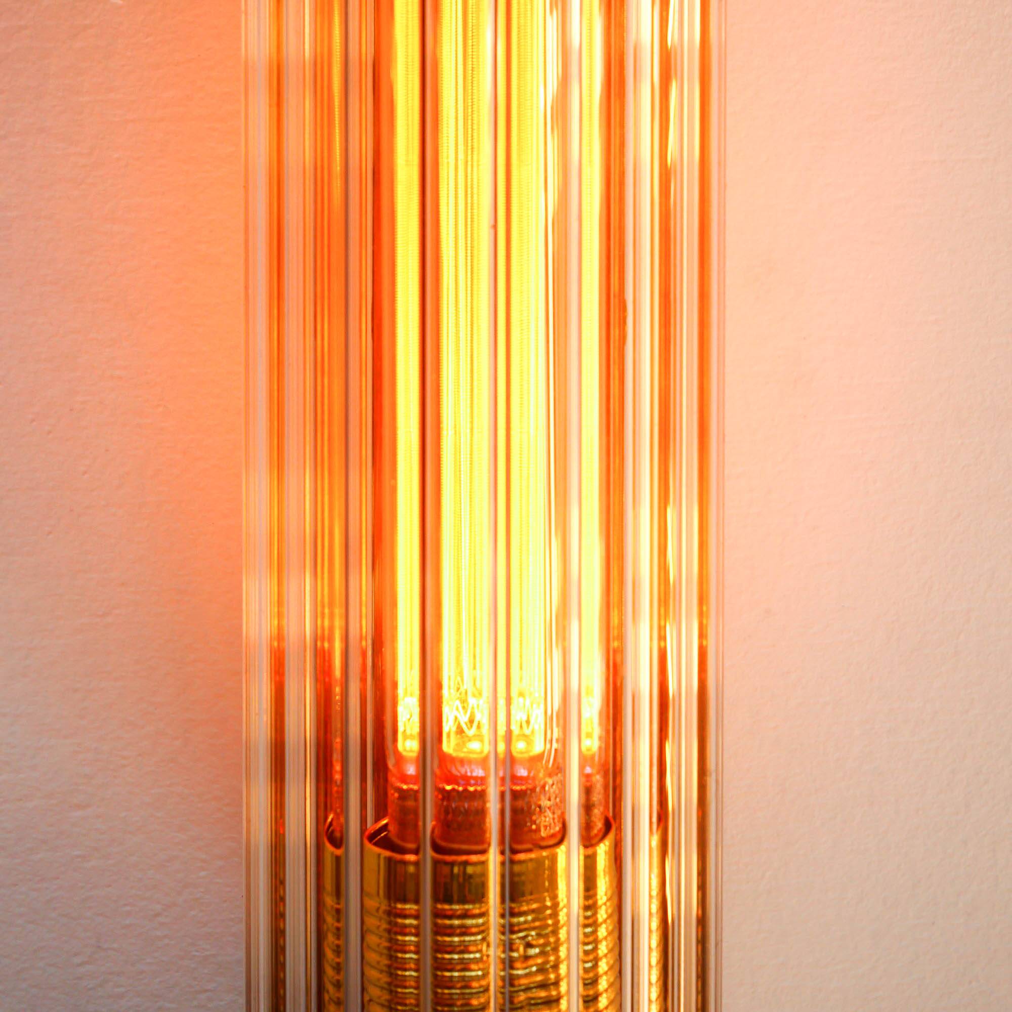 Cylindrical wall light with streaked glass and brass