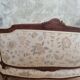 Small sofa or bench in Louis XV style, rococo.