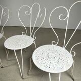 4 vintage wrought iron chairs