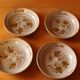 Four bowl-shaped plates in vintage Niderviller stoneware with plant decoration
