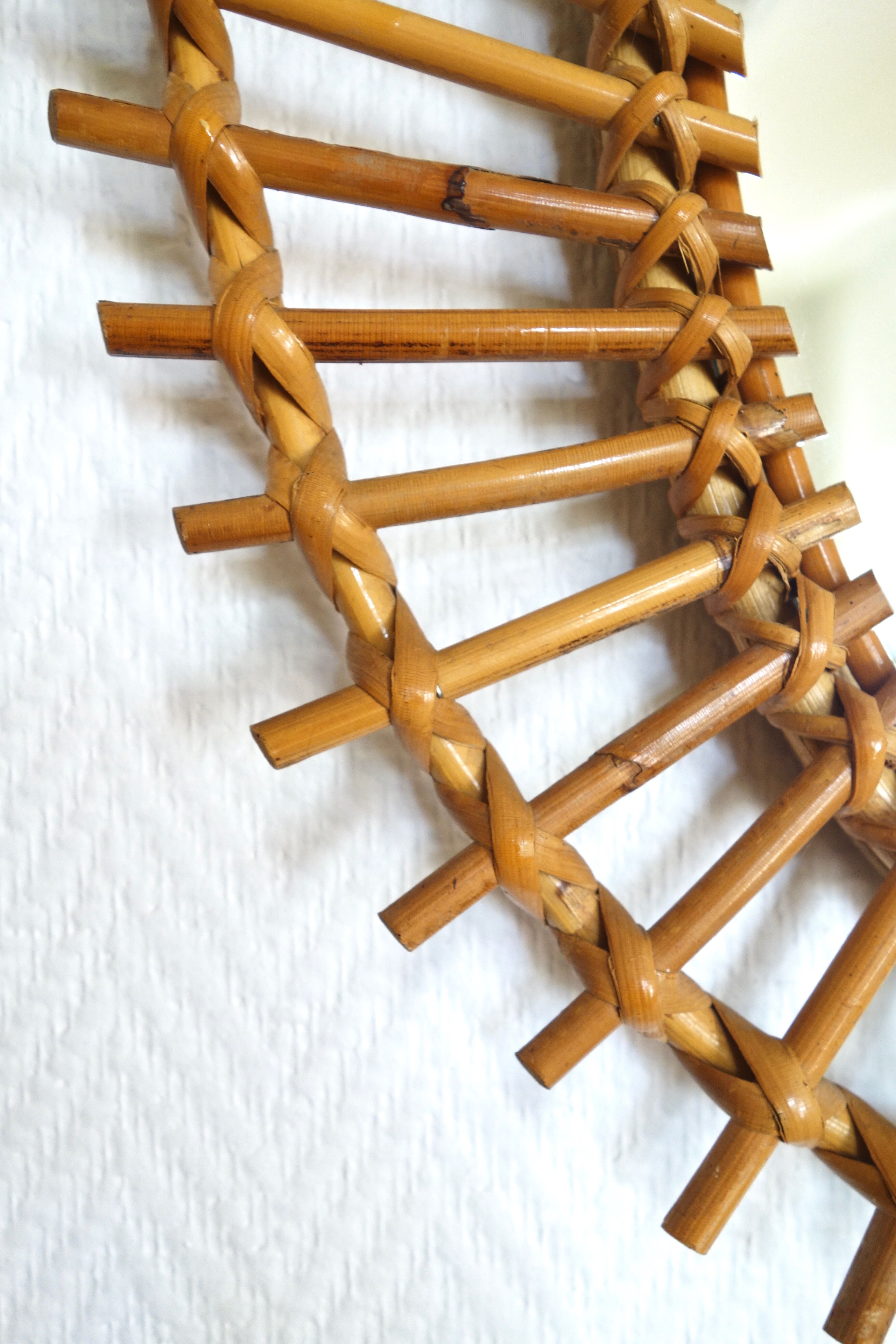 Free-form sun mirror in 60s rattan