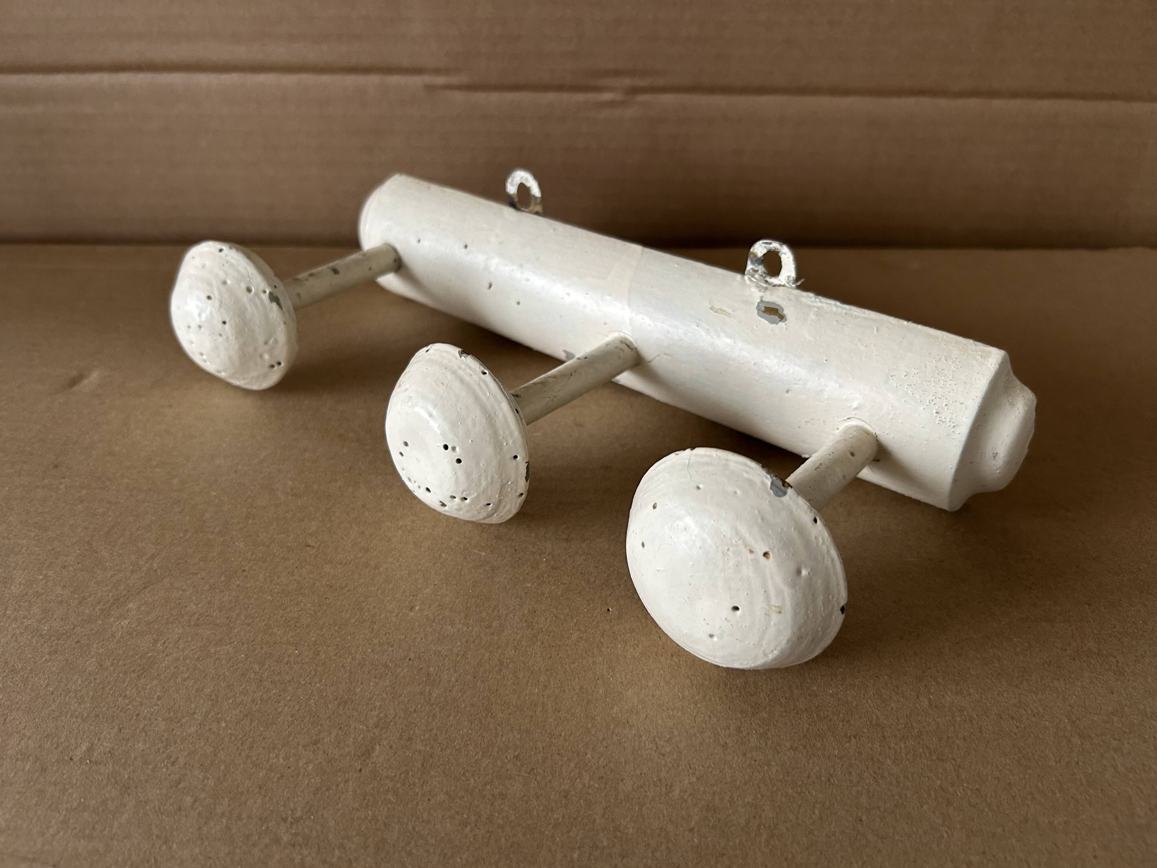 Antique wooden wall-mounted coat rack