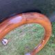 Round varnished wooden mirror