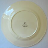 Circular dish with floral decoration and twisted edges