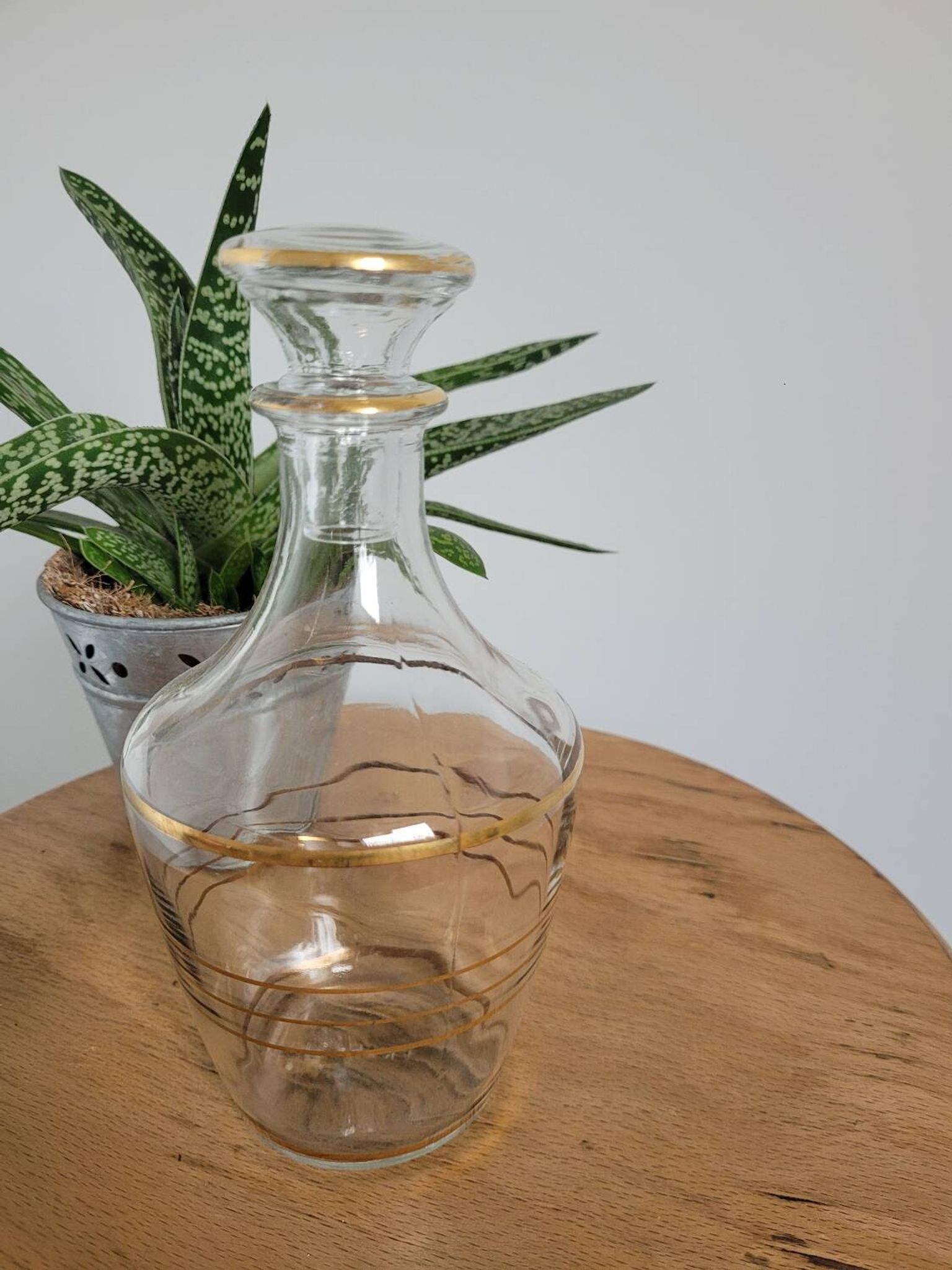 Small glass bottle with gold edges