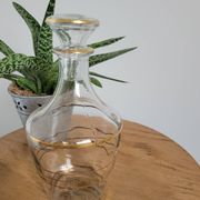 Small glass bottle with gold edges