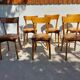 6 vintage 1960s wooden bistro chairs with camel faux leather.