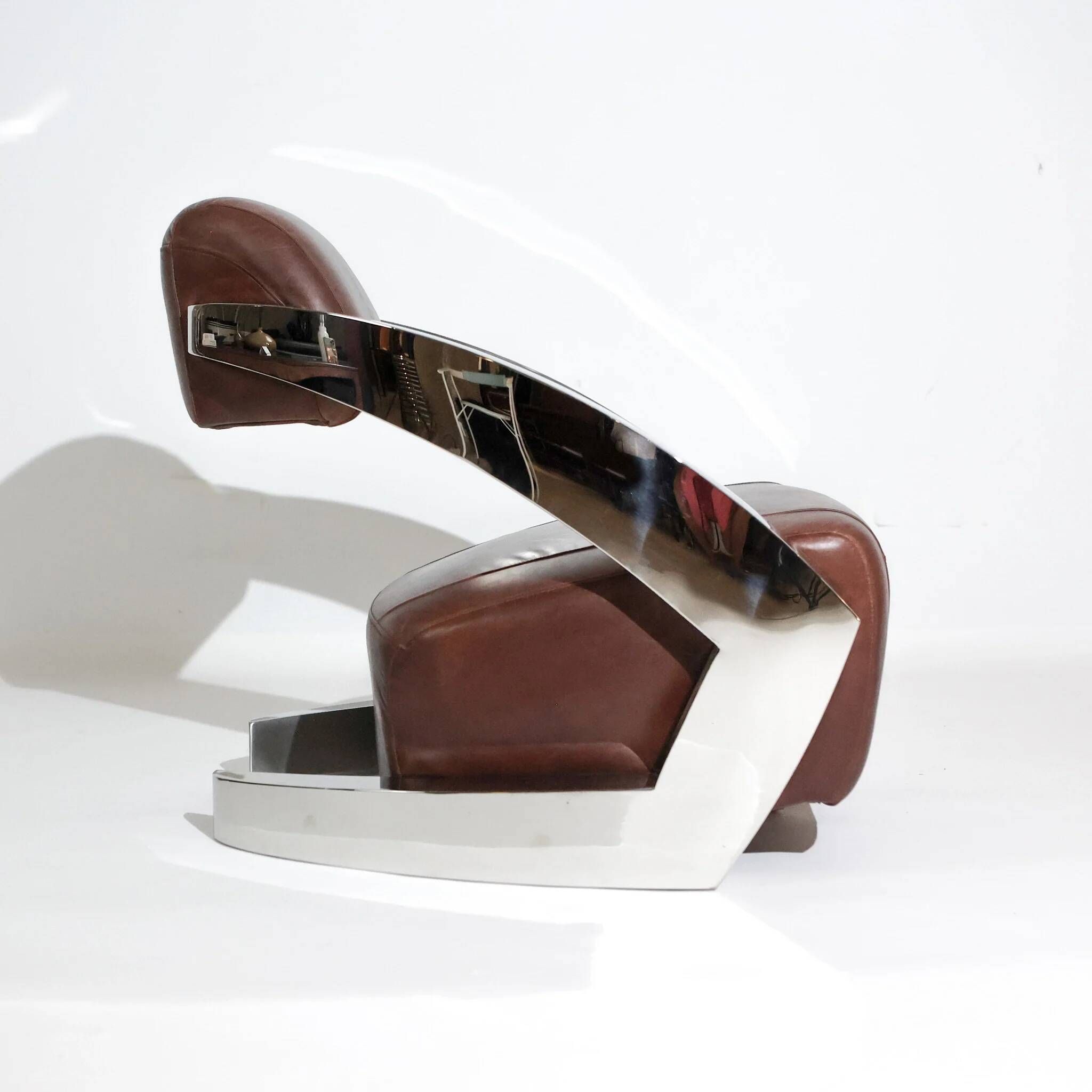 Pair of vintage lounge chairs Demon/Aviator in cognac leather and polished steel, Art Deco style.