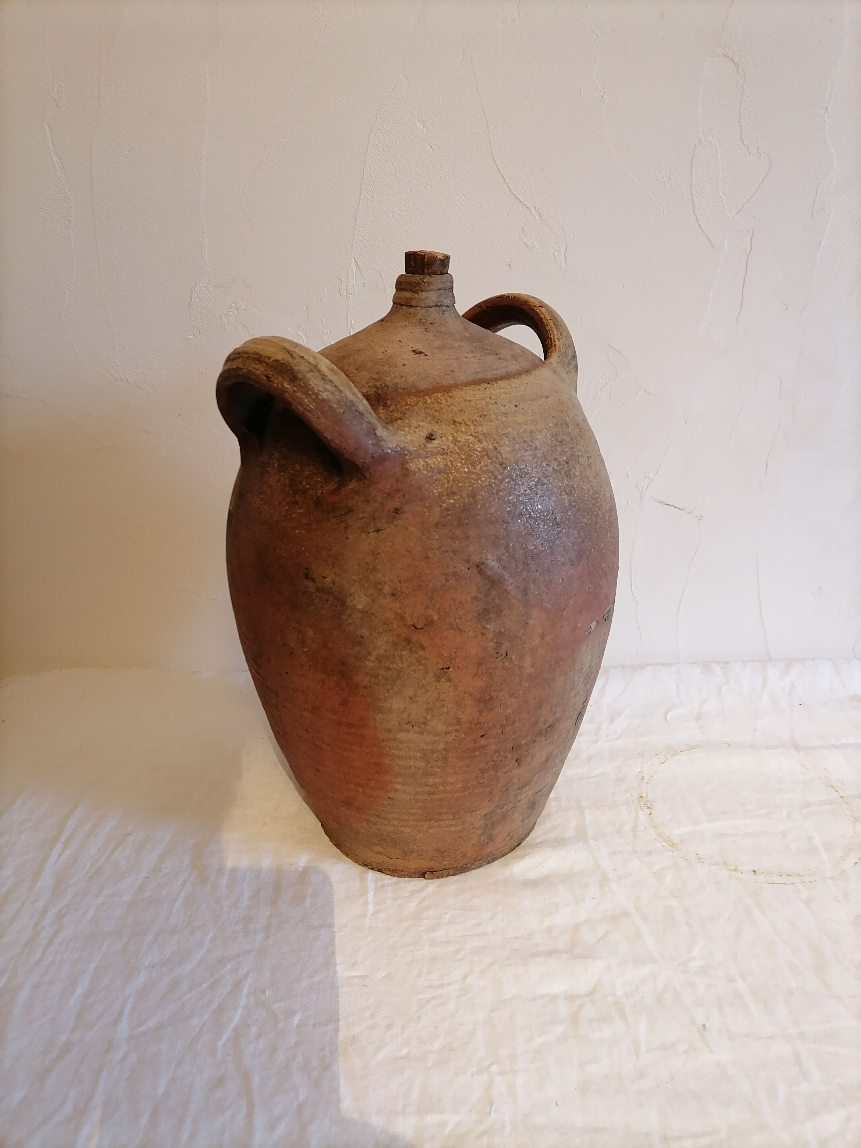 Old jar, glazed sandstone jug. Early twentieth century.