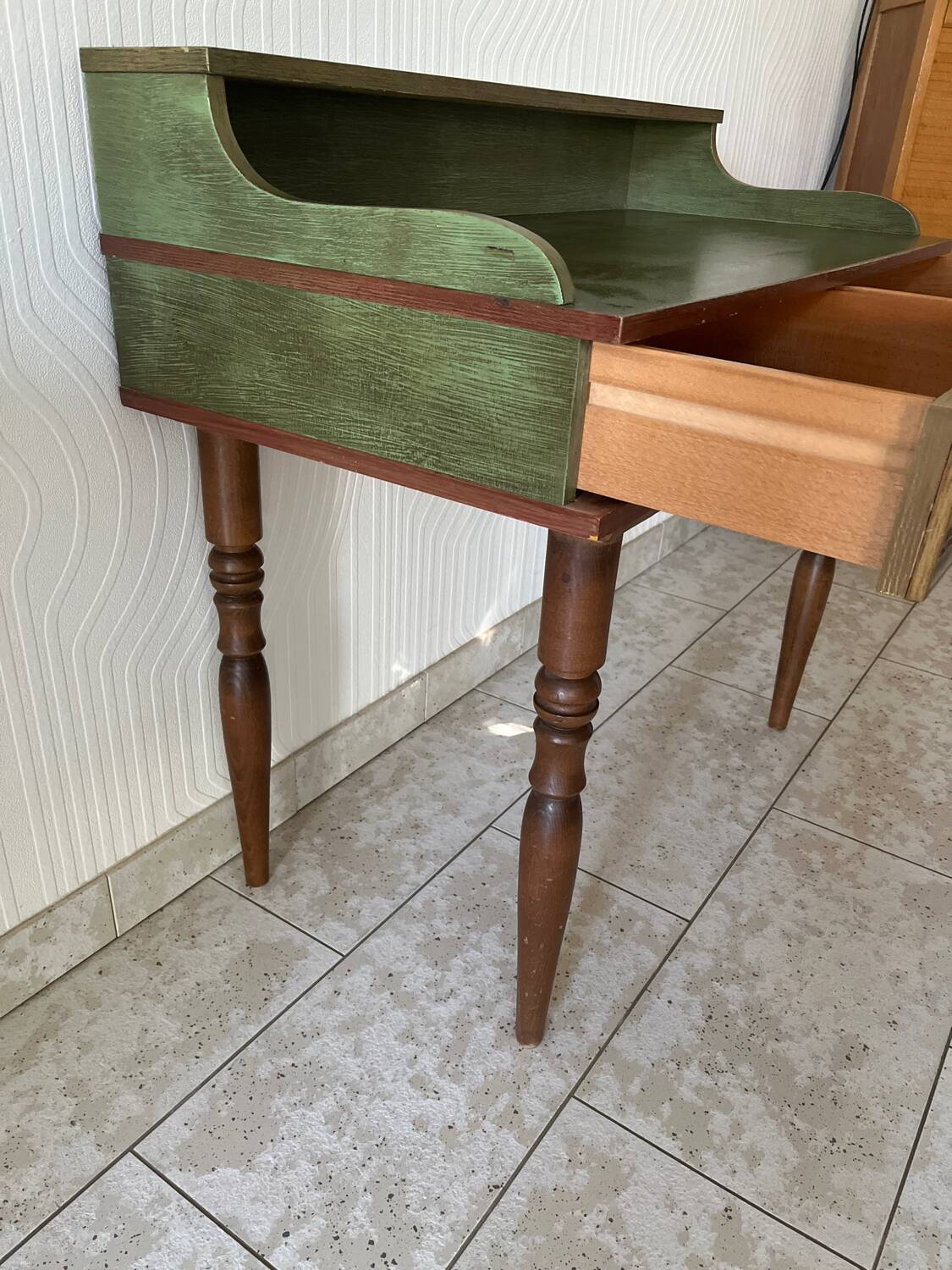 Wooden dressing table with olive green chair and floral patterns