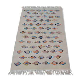 Tapis blanc à motifs géométriques multicolores fait main en pure laine