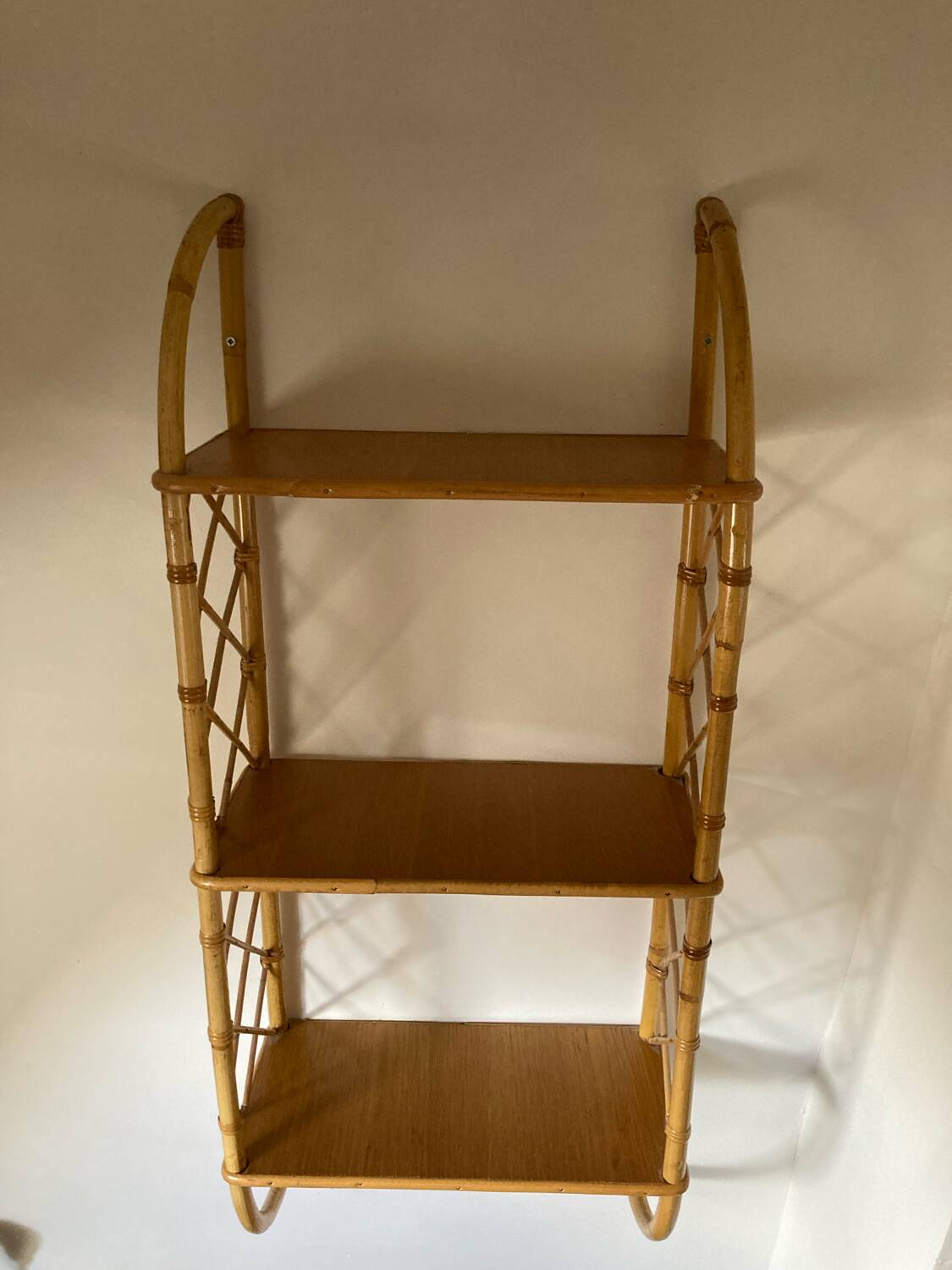 Vintage vertical wall mounted rattan shelf