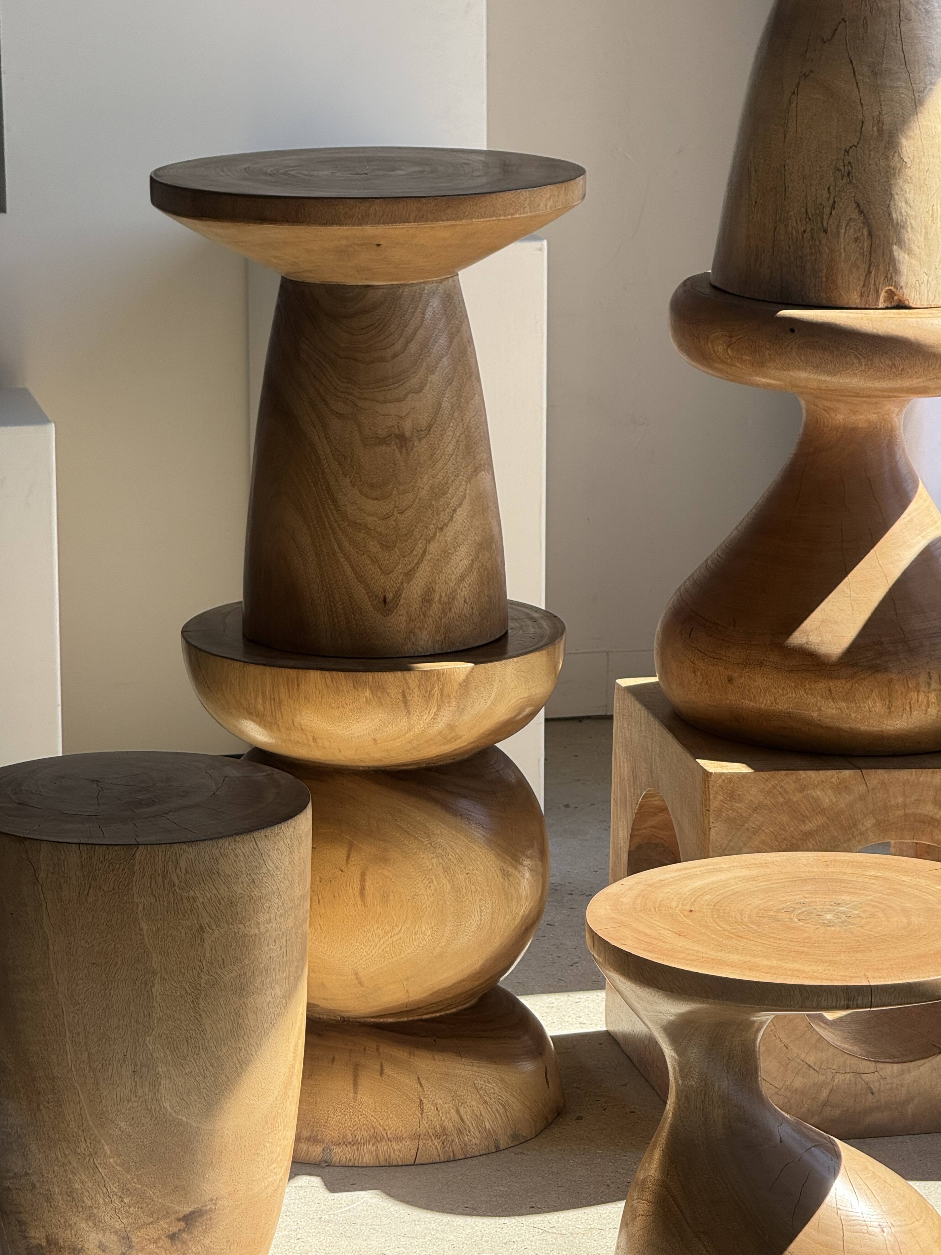 Natural solid mango side table (monoxyle) with conical legs.