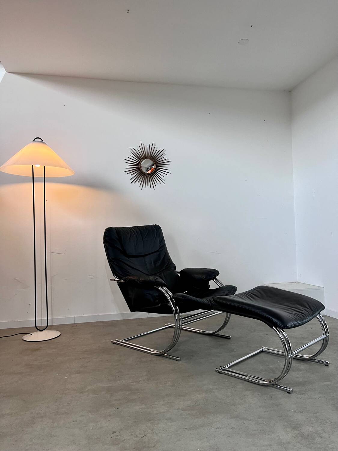 Old armchair and ottoman black leather tubular chrome bauhaus design from the 70s