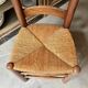 Provençal chair in dark wood and woven straw.