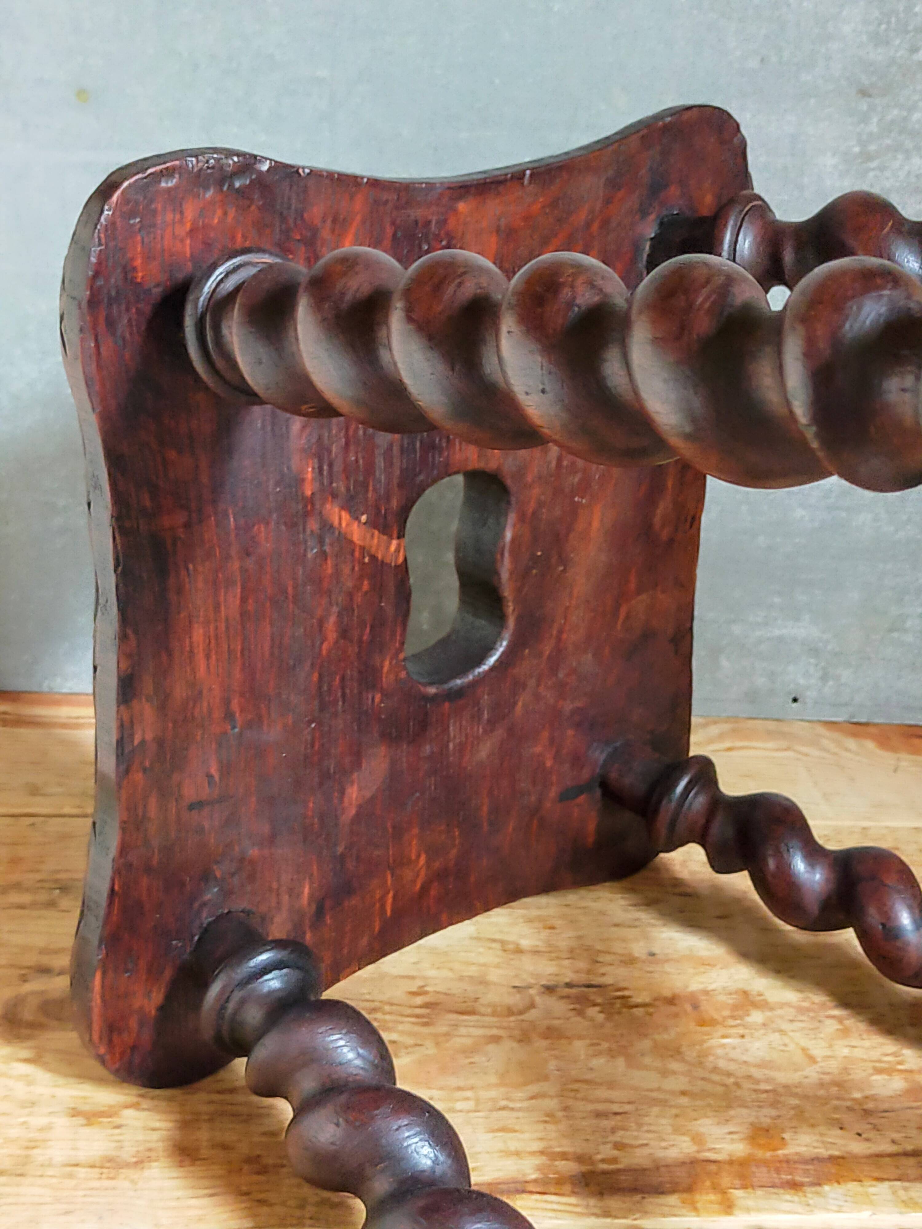 Antique stool in turned and carved solid wood