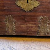 Old Indian wooden wedding chest decorated with chiseled brass plaque. India late 19th/early 20th