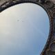 2 antique oval mirrors in heavy metal