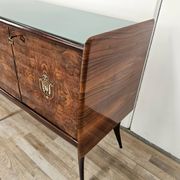 Mid-century mahogany buffet with teal glass and compartments with a drawer.