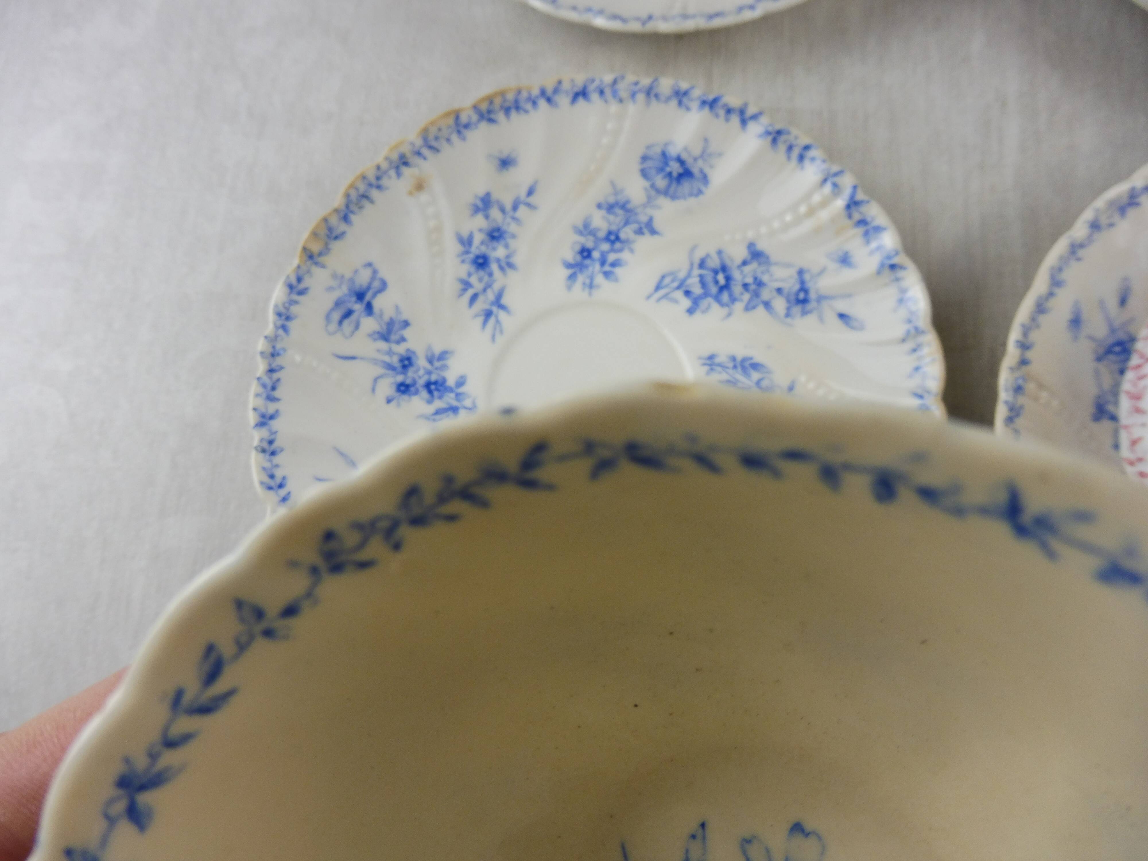 Lot of porcelain cups and under cups, twisted decoration, from Sarreguemines