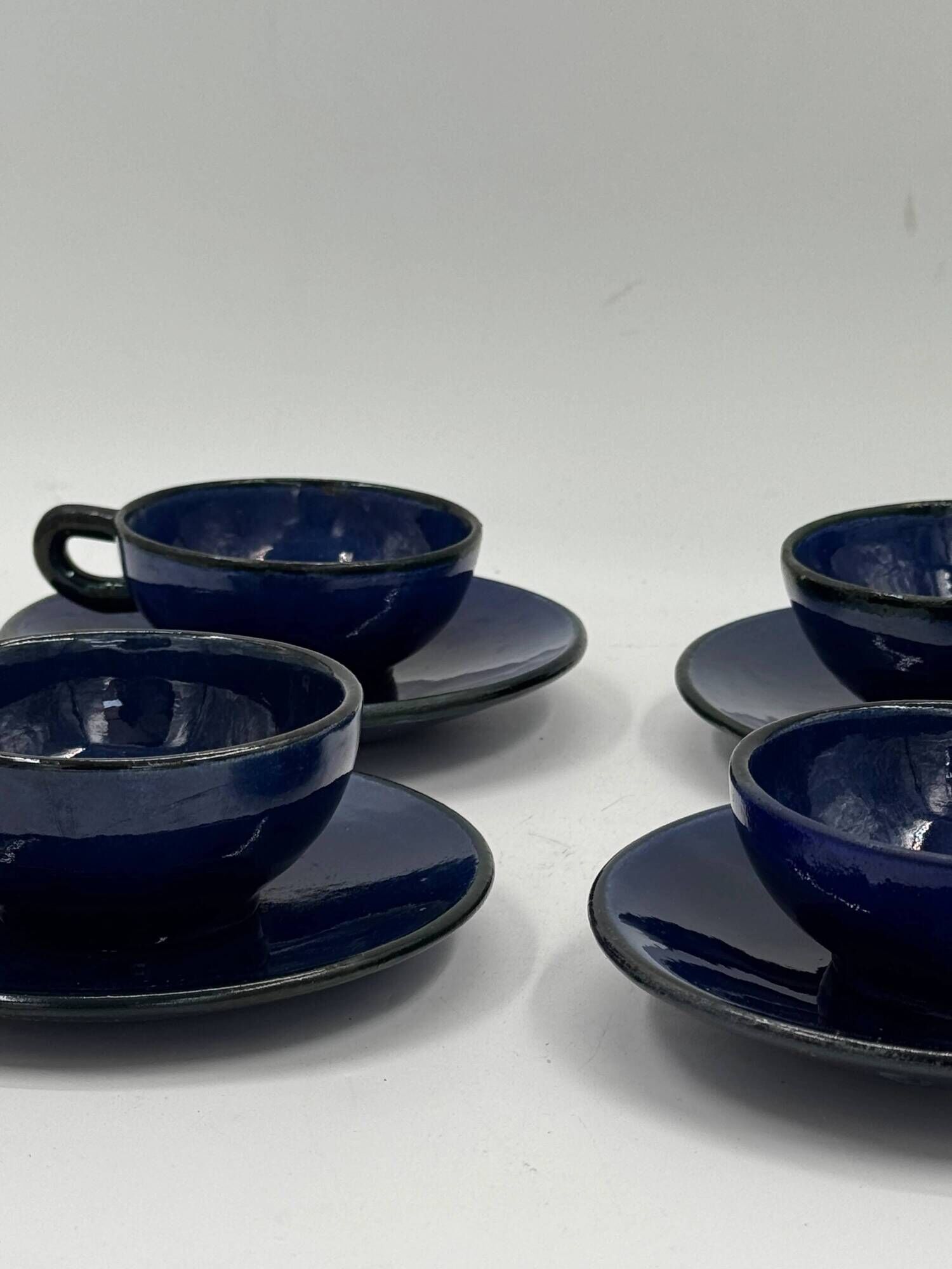 Set of 4 vintage ceramic cups and saucers, cobalt blue glaze.
