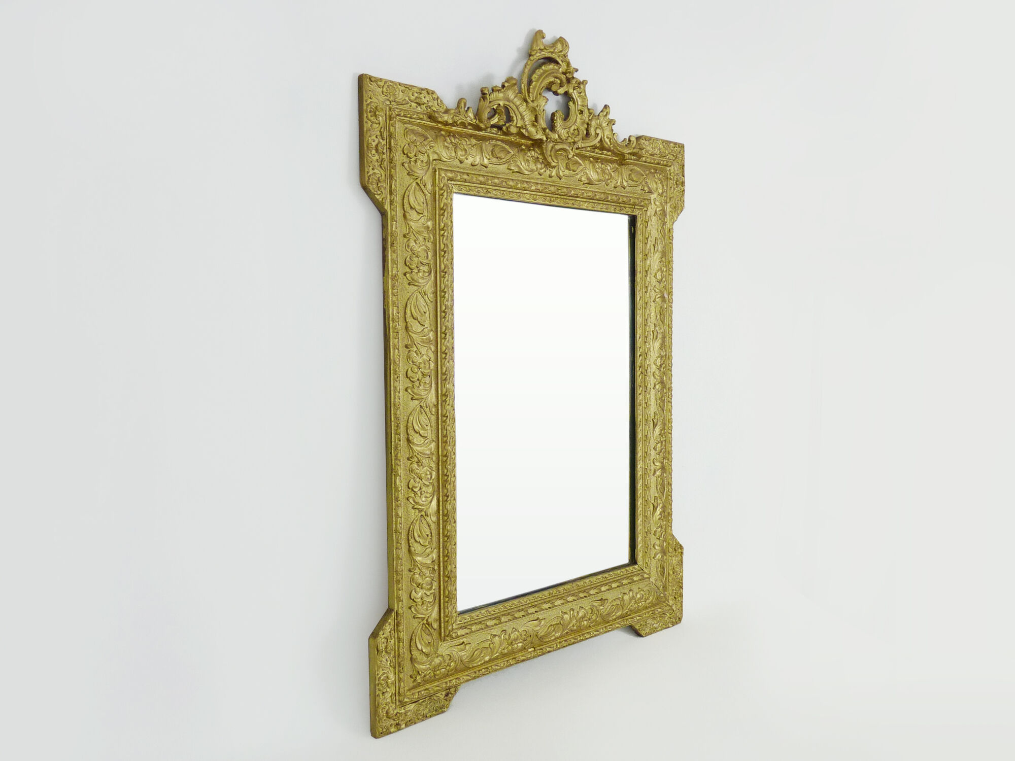 Old wall mirror in wood and gilded stucco, Louis XVI style. XIXth