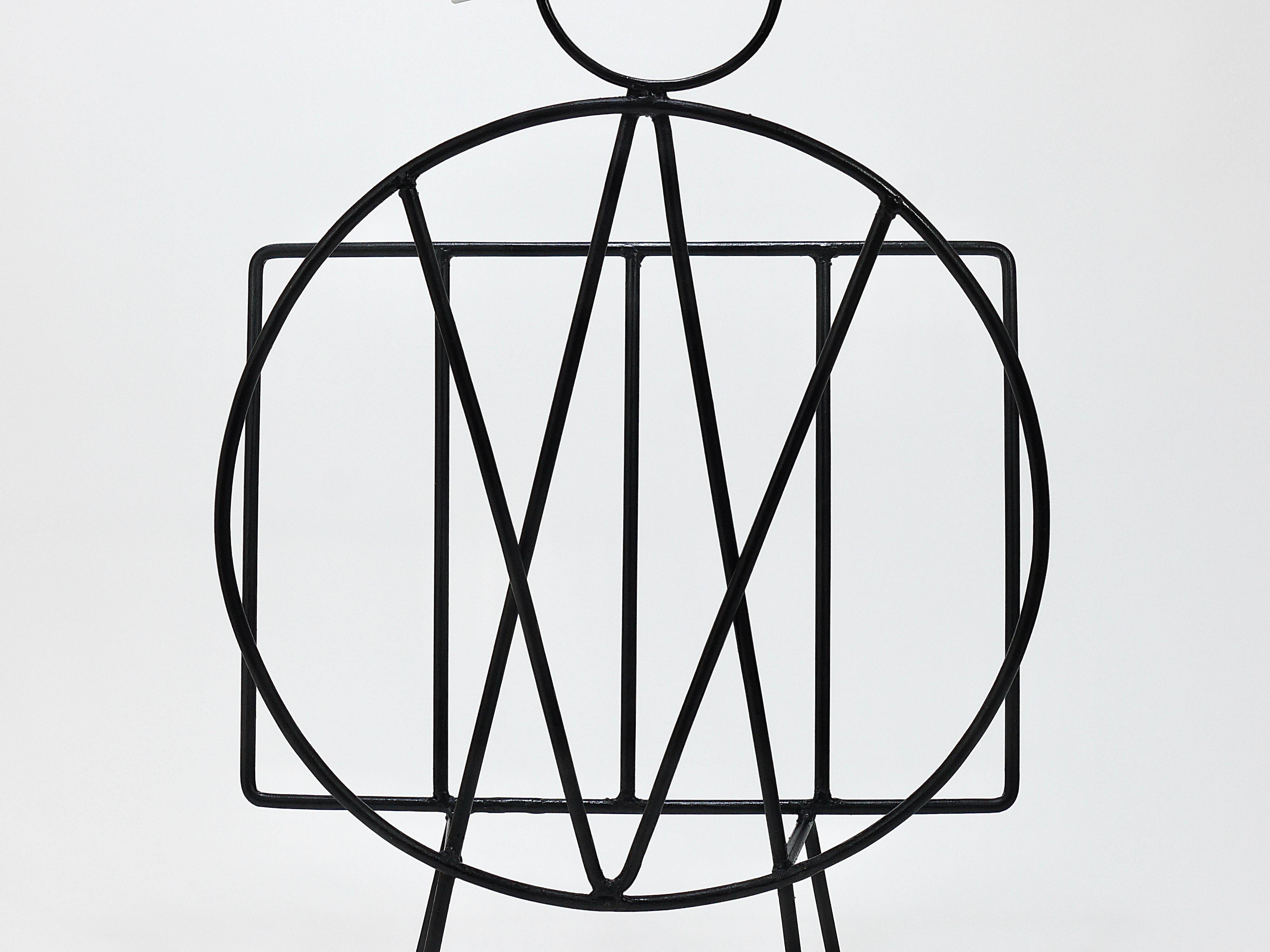 Mid-century cat-shaped magazine or record holder, iron, Italy, 1950s.