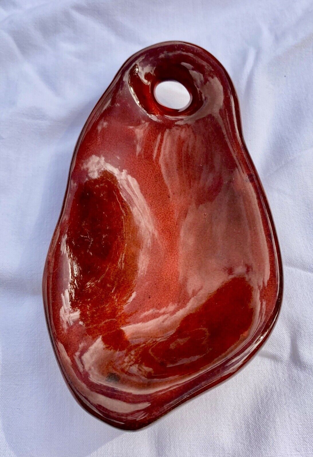 Enamelled ceramic flat monogram of Max Idlas on the back