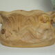 Art Nouveau jardinière with bas-reliefs in terracotta.