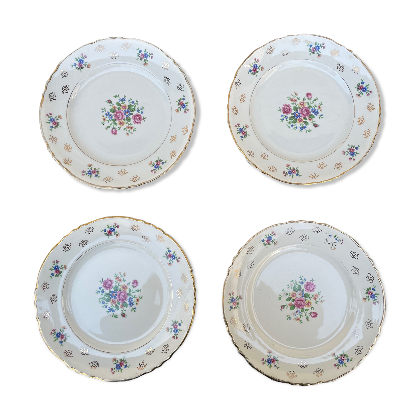 Set of 4 plates with floral motif, golden border early twentieth century