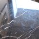 Antique bistro pedestal table in cast iron and veined black marble