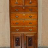 Victorian high chest of drawers in walnut with a bronze gallery.