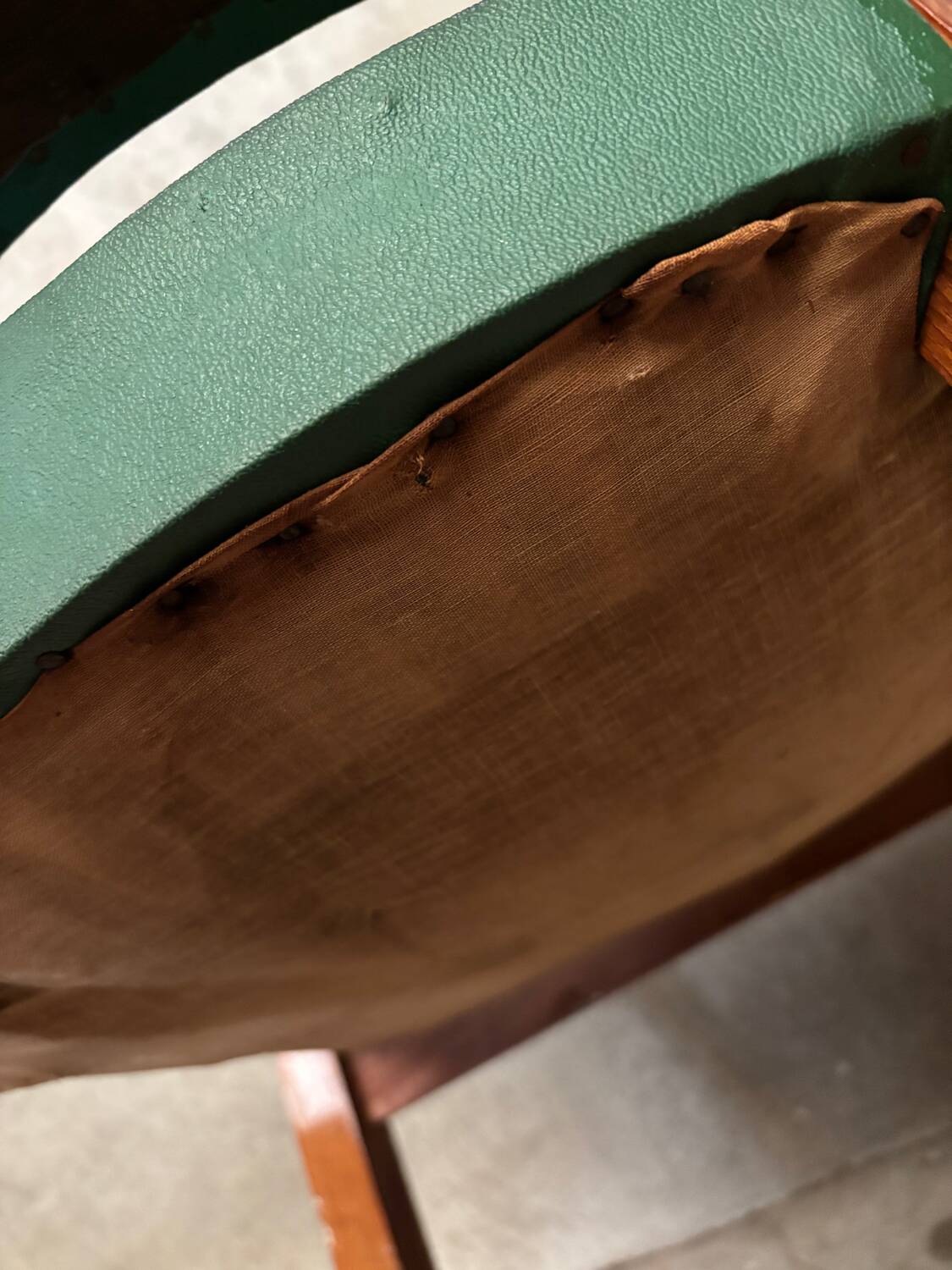 Green faux leather bridge chair