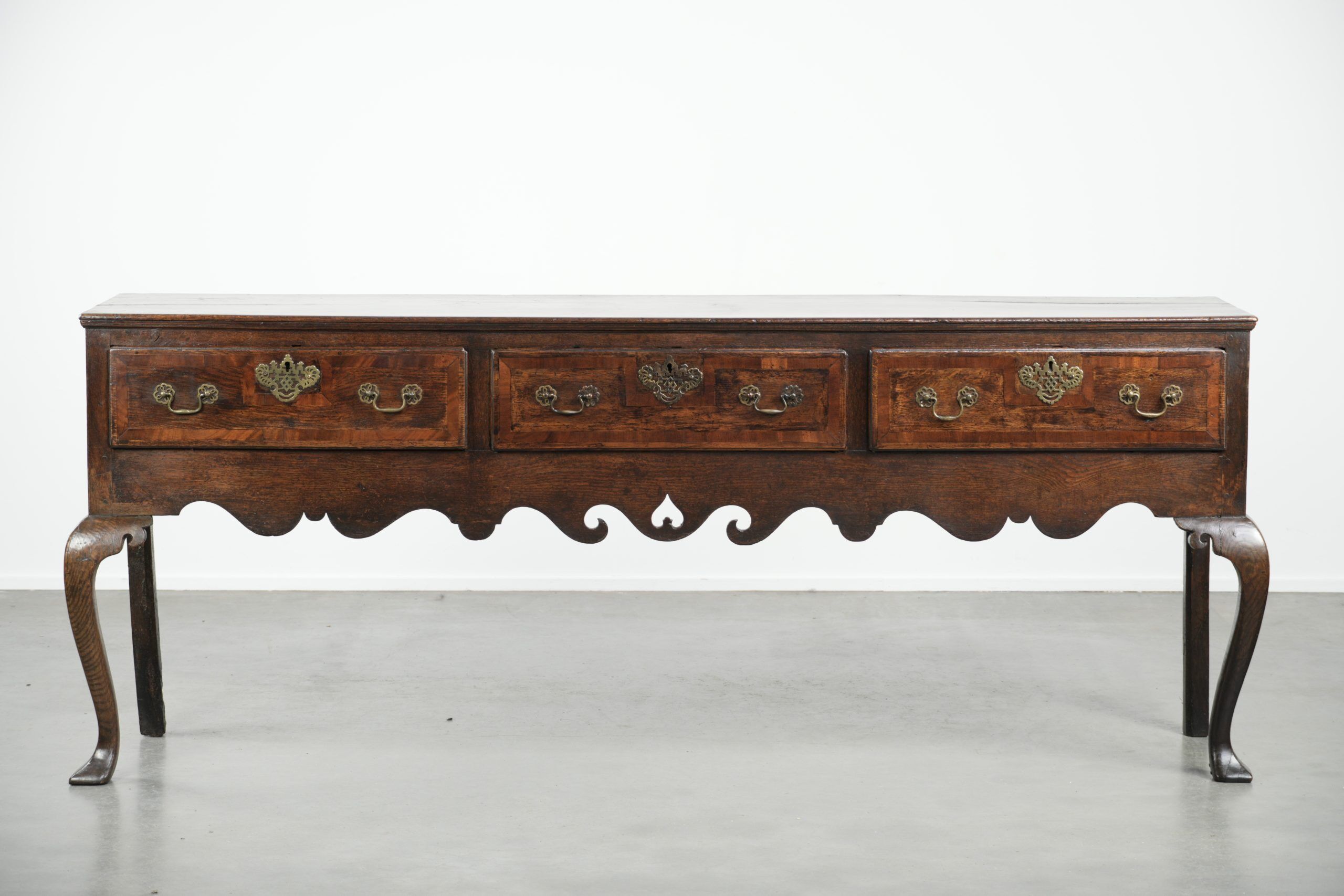 Large antique English oak sideboard from the 18th century with elegant legs