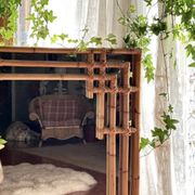 Large sculptural mirror handmade from natural bamboo and woven rattan, 1960.