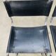 Paire de chaises cantilever simili cuir noir et chrome