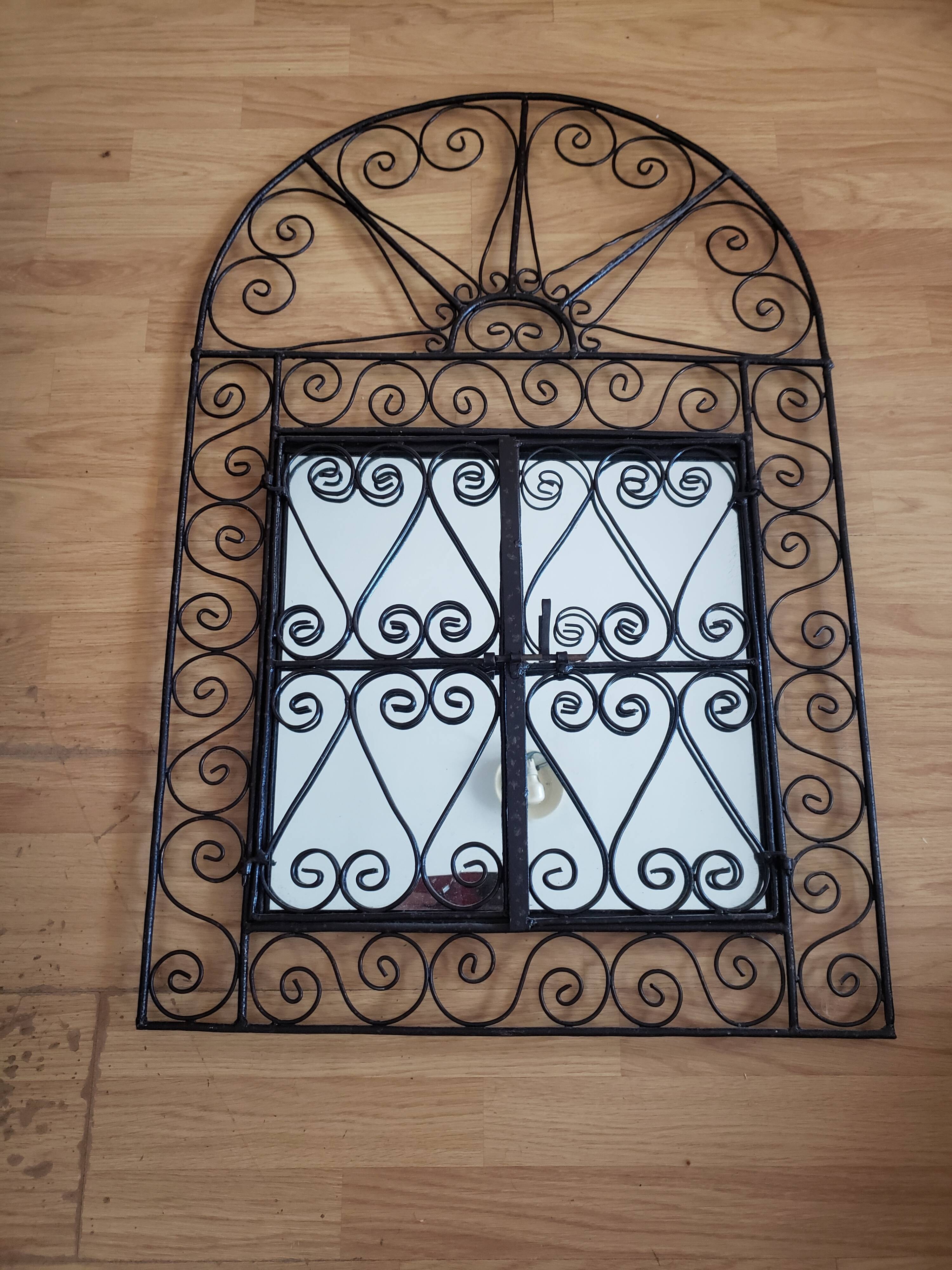 Oriental mirror with wrought iron door