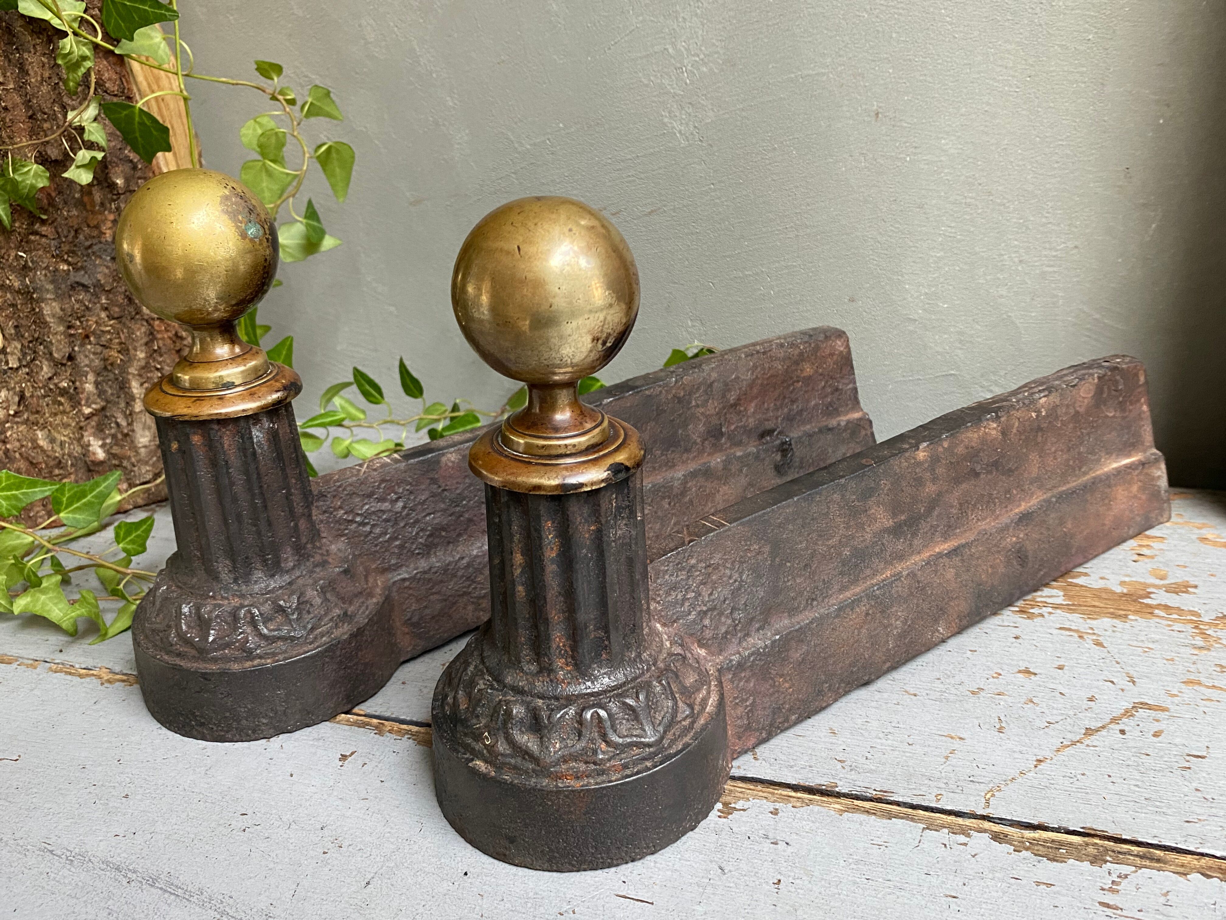 Pair of cast iron and brass chenets