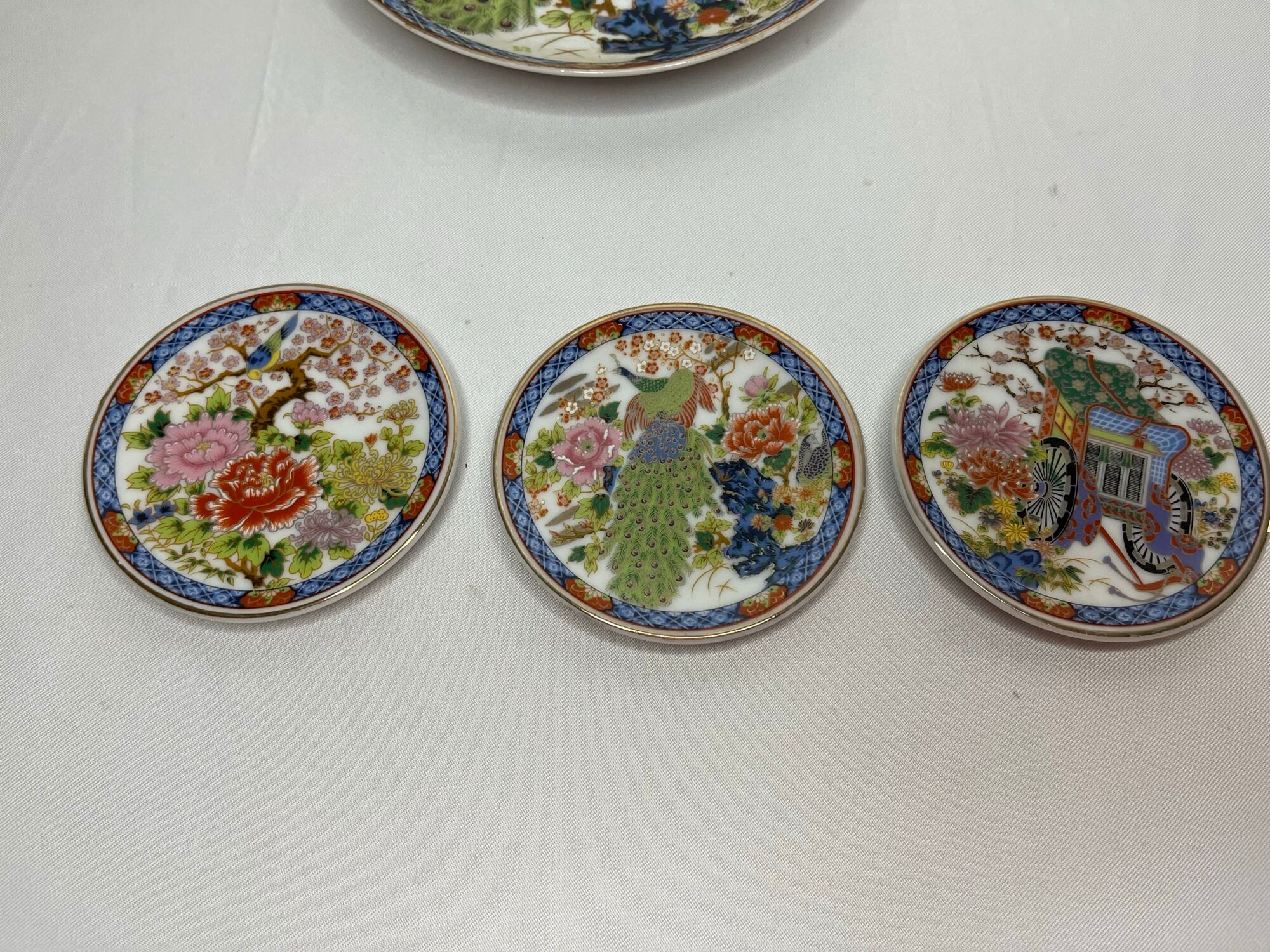Set of 4 porcelain plates decoration peacock Japan XXth