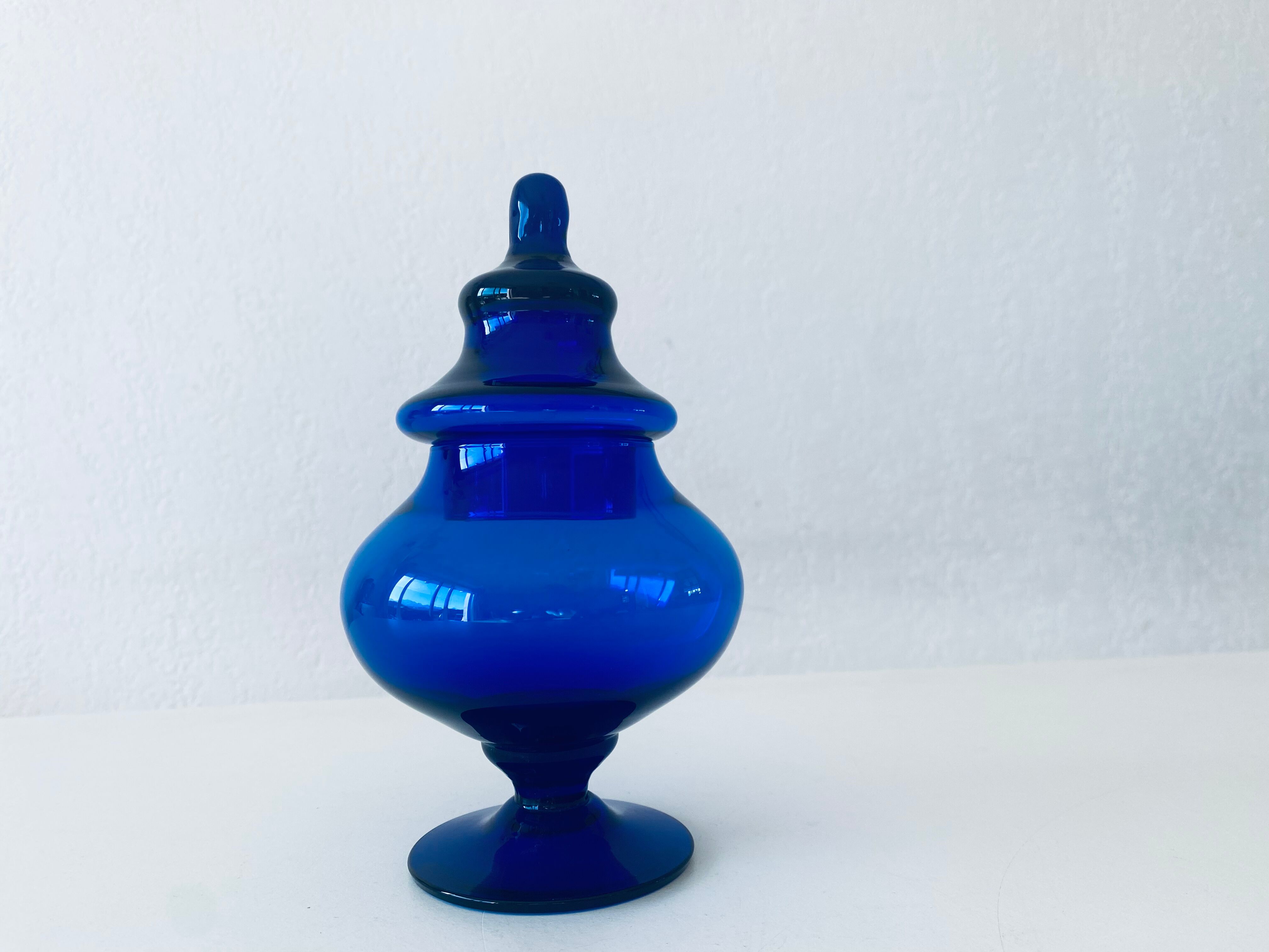 Blue glass apothecary shaped bottle
