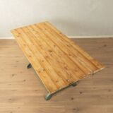 Unique dining table with cast iron base and solid wood top