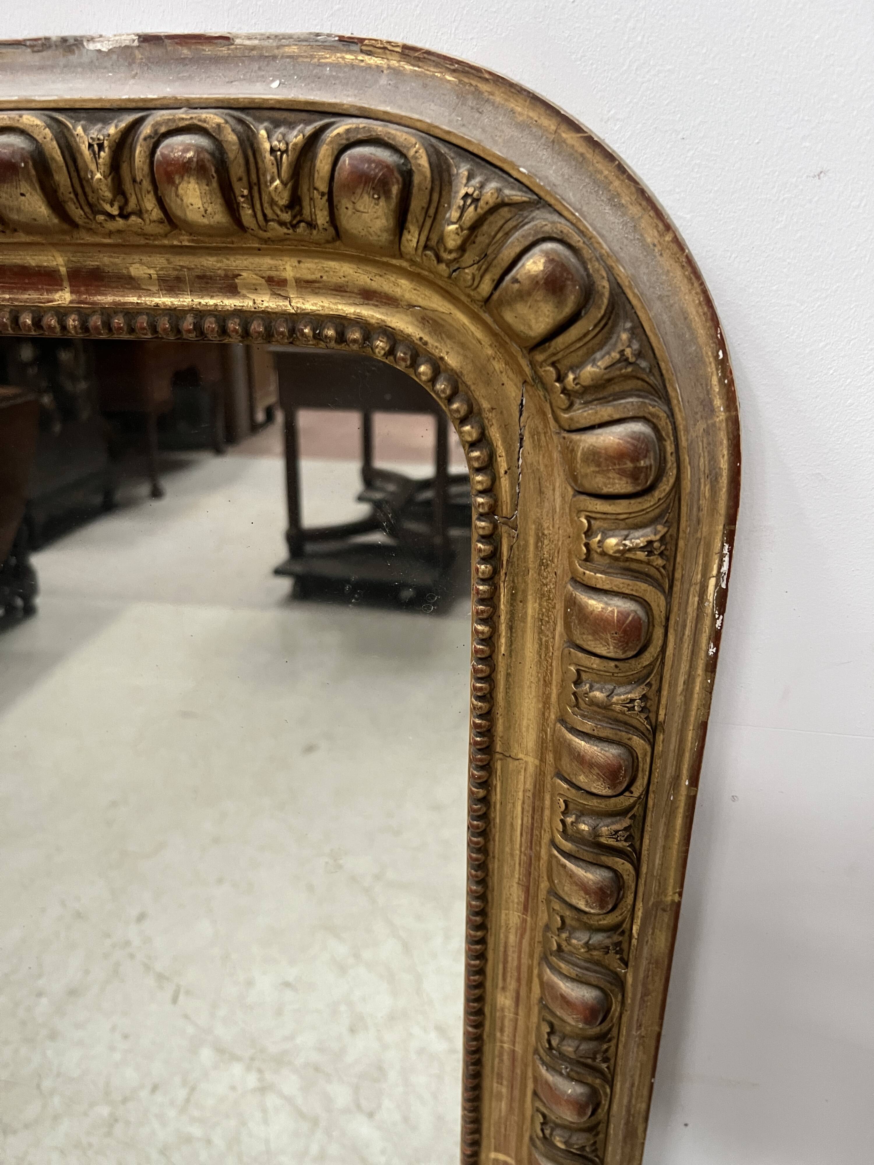 Louis Philippe gadrooned mirror in wood and gilt stucco, 19th century