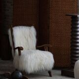 Pair of Scandinavian armchairs in oak and long-haired Icelandic sheepskin by Henning Kjærnulf, 1950.
