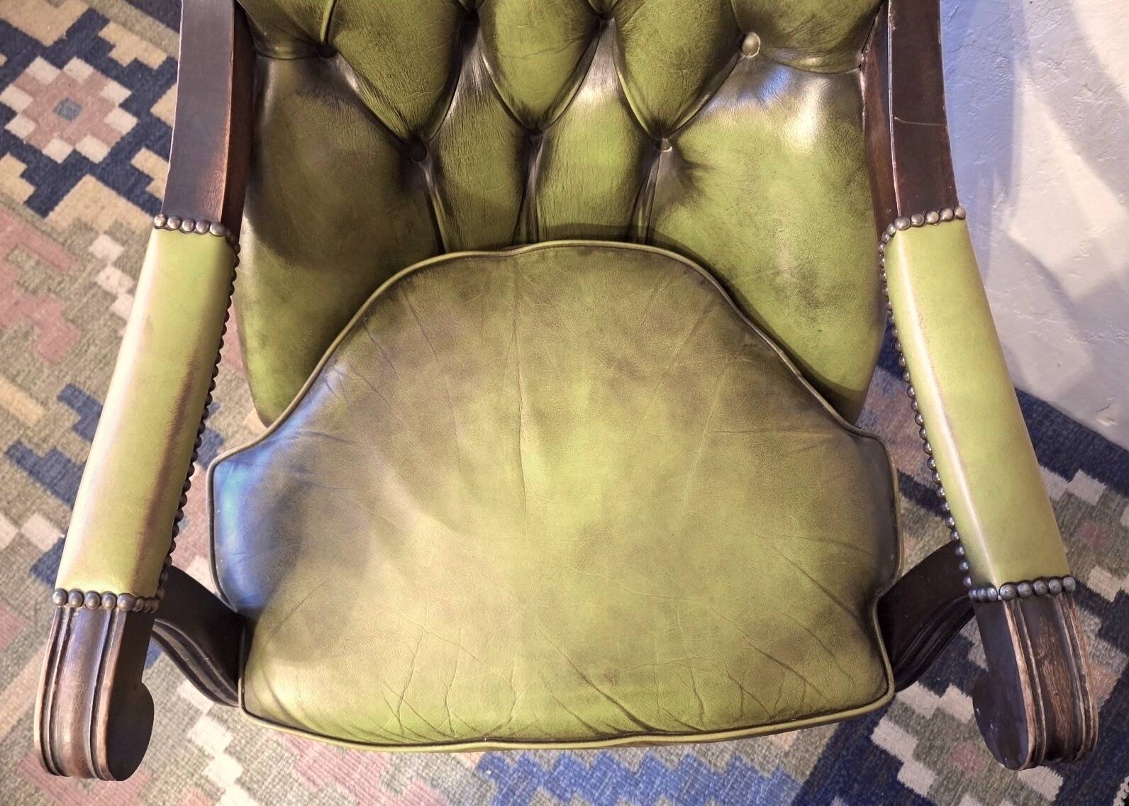 Olive green tufted leather library armchair, 1970s