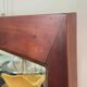 Grand miroir mural en bois exotique massif