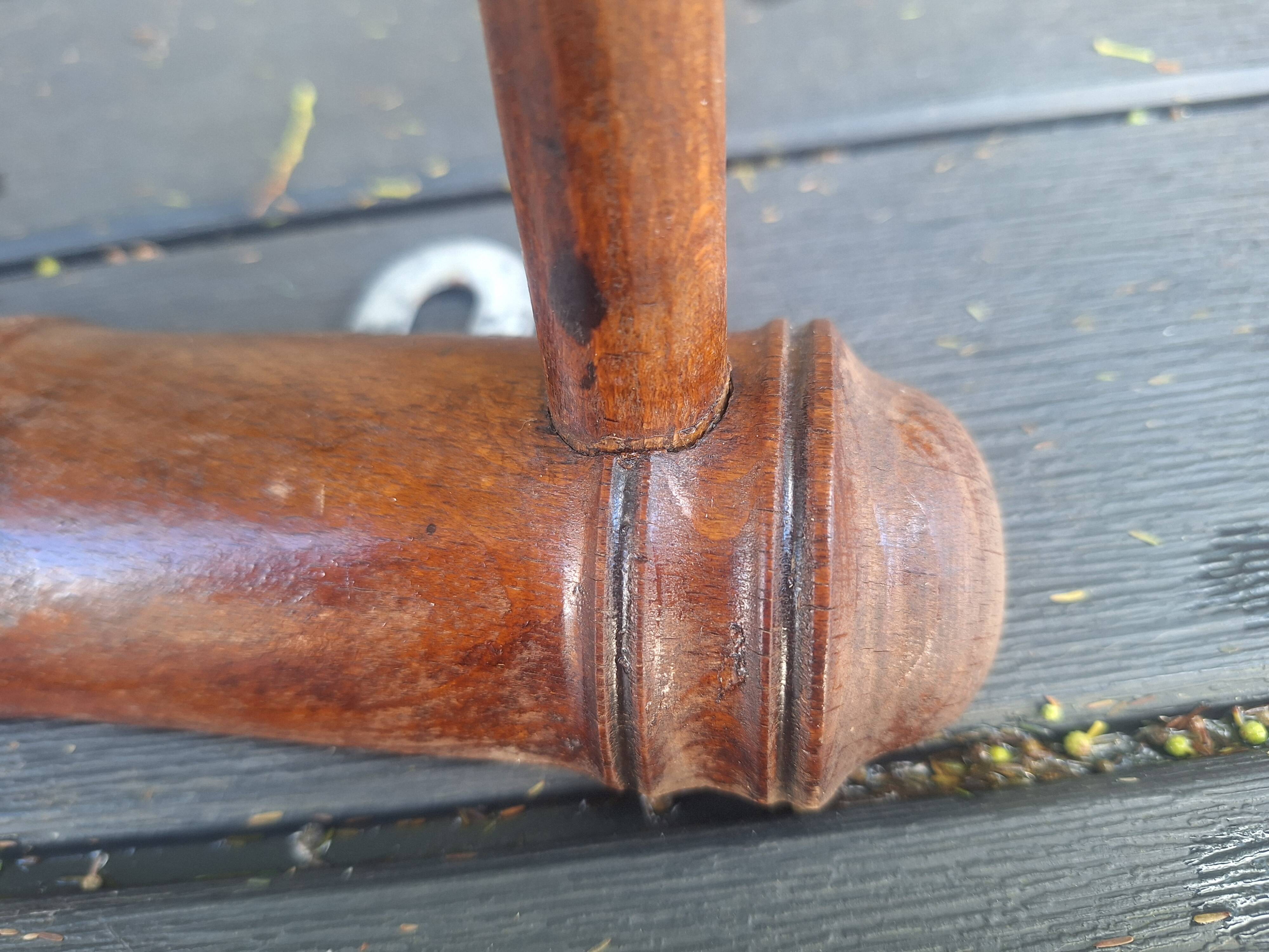 Old wooden coat hook imitating bamboo.