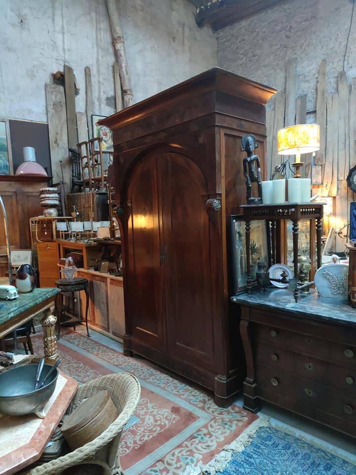 A walnut wardrobe with marquetry and boxwood stringing, dating from the Consulate period, circa 1810.