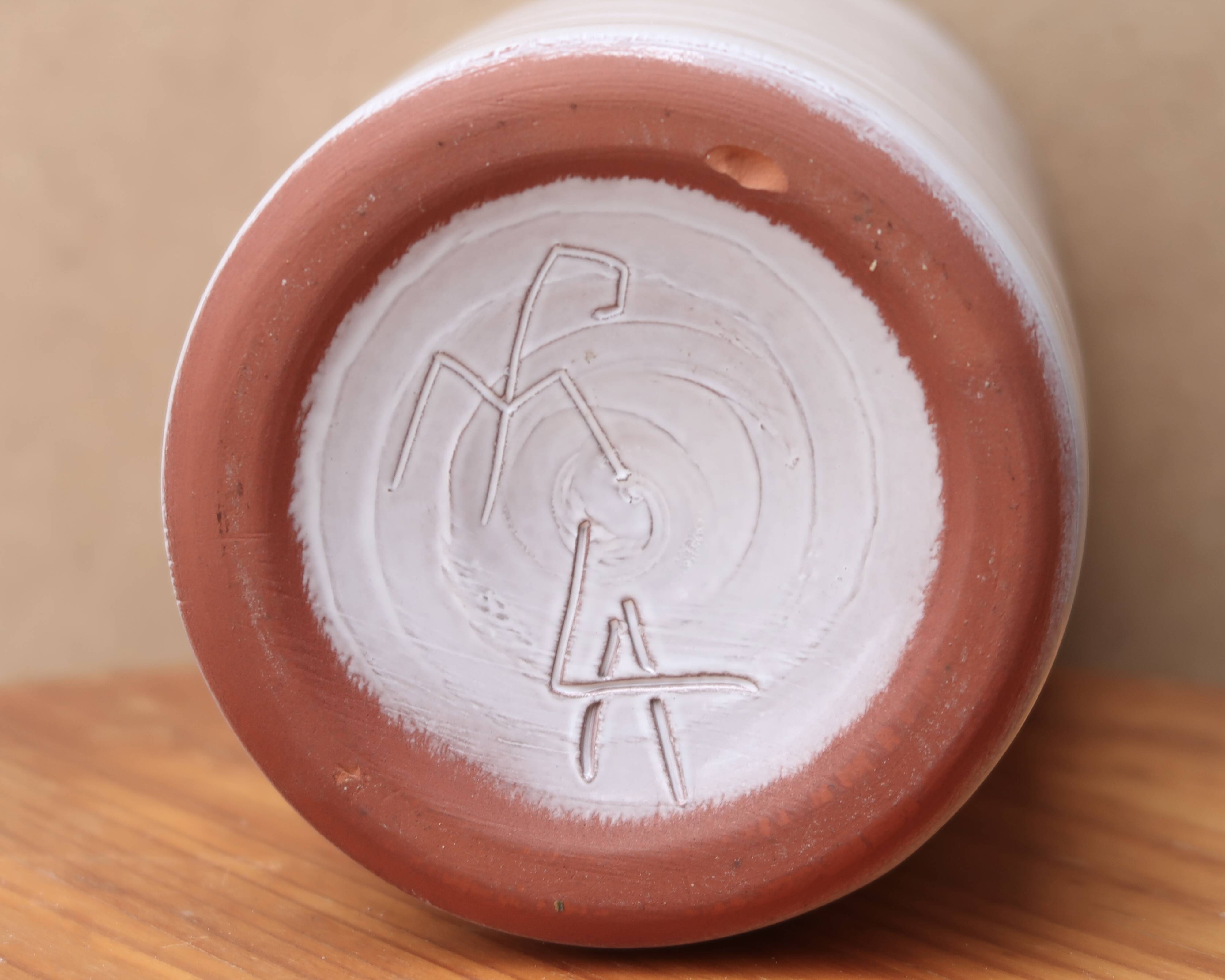 Vase by Antonio Lampecco minimalist white ceramic scroll