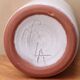 Vase by Antonio Lampecco minimalist white ceramic scroll