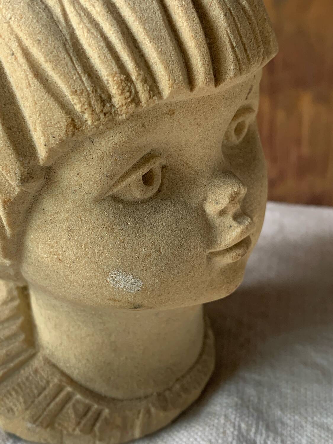 Stone bust of a little girl